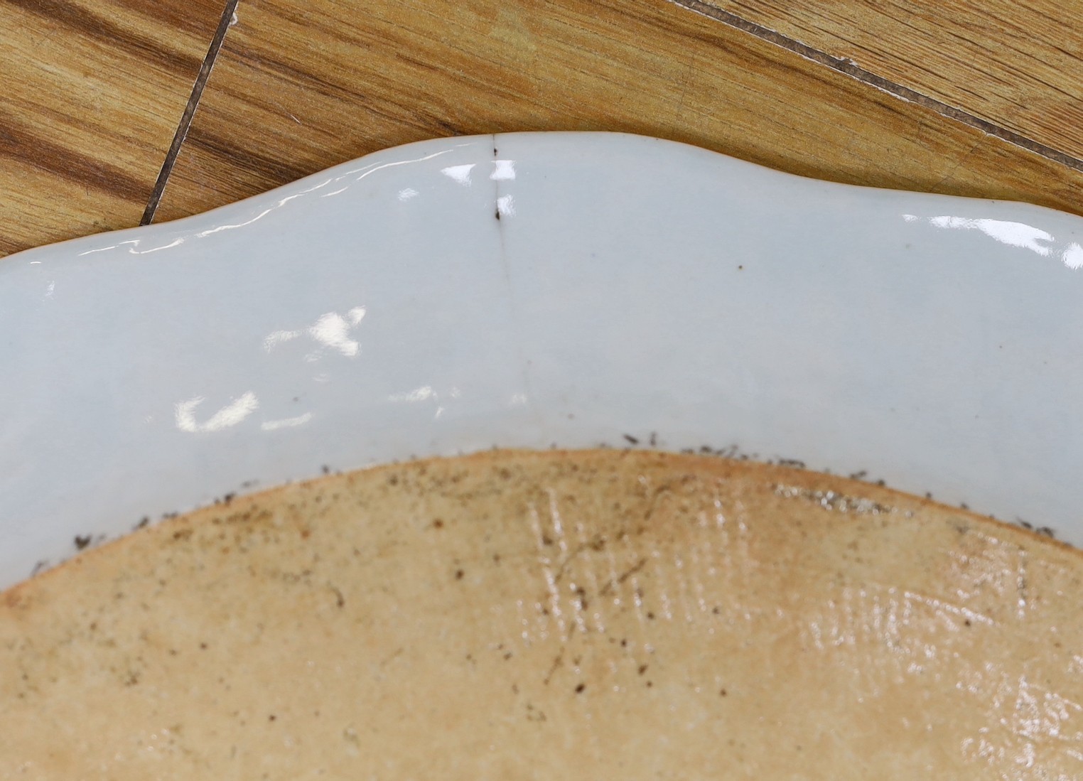A pair of Chinese Famille Rose ‘peacock’ oval dishes, Qianlong period, 43cms wide